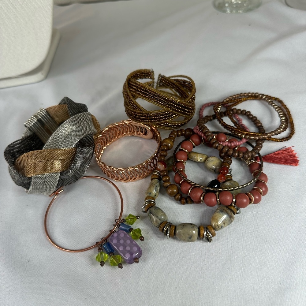 Large group of funky boho neutral tone bracelets